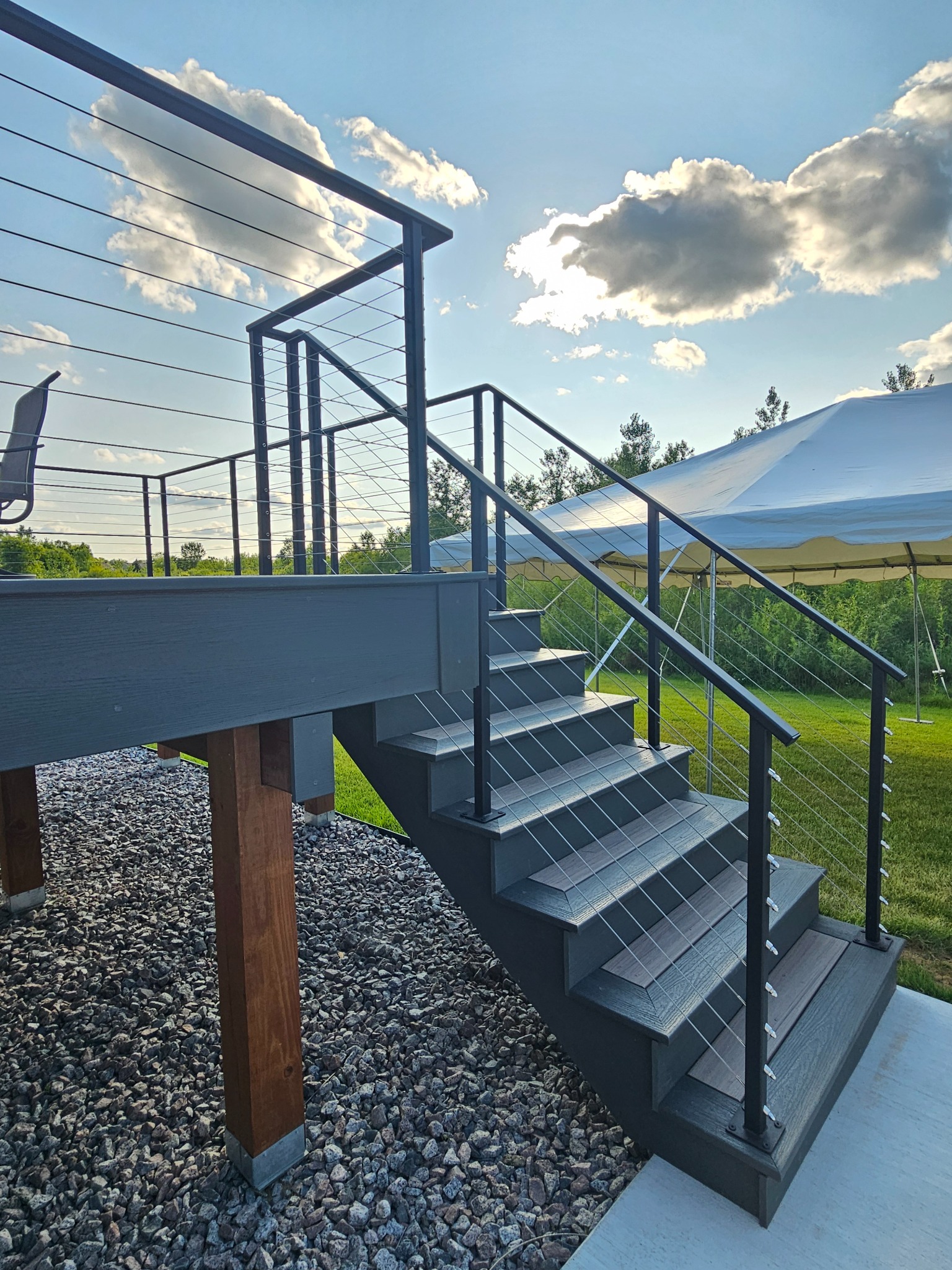 Close view of a custom black cable-rail stair
